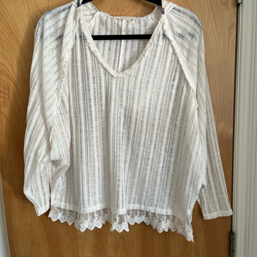 Anthropologie Scrapbook cream-white top with a hood.